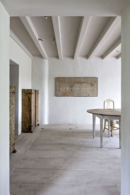 Minimal decor in modern farmhouse room with exposed rafters and organic slow living vibe - found on Hello Lovely Studio