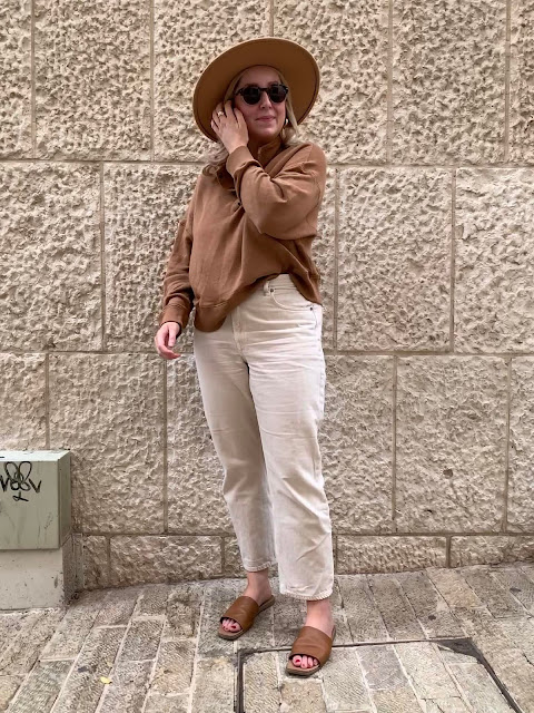 woman in hat and neutral colours