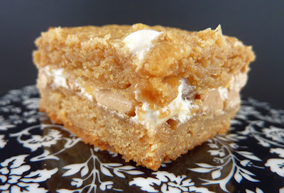 Peanut Butter Mallow Bar: A peanut butter bar with a filling of marshmallow creme and peanut butter chips, photographed on a black and white floral plate