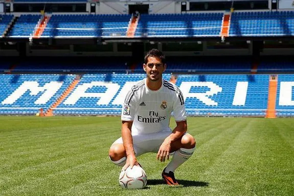 New Real Madrid signing Isco poses for photographers during his official presentation