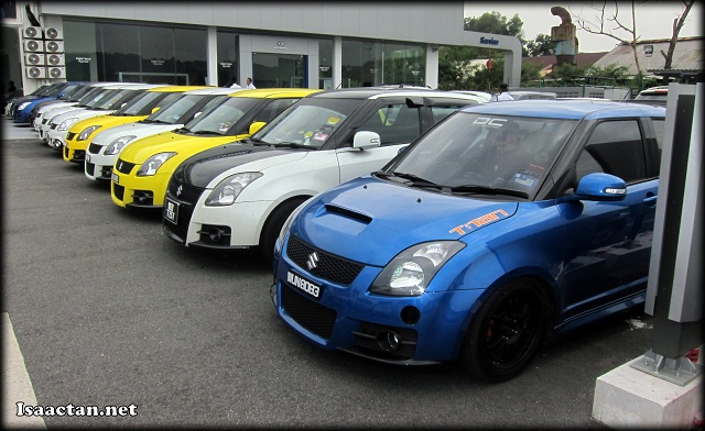 Previous gen Suzuki Swift Car Club owners proudly showing off their ride