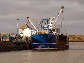 Photo of a fishing boat in Maryport Harbour