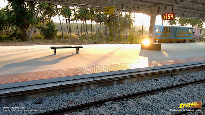 Evening sunshine reflecting off platform at Channarayapatna railway station
