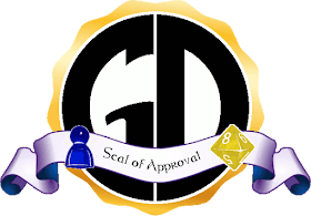 The Game Dork Seal of Approval. The GD-in-a-circle Logo with a gold-leaf style border, with a bluish ribbon across the bottom bearing the words 'Seal of Approval.' The blue meeple and yellow eight-sided die from the Game Dork Logo rest on either side of the ribbon.