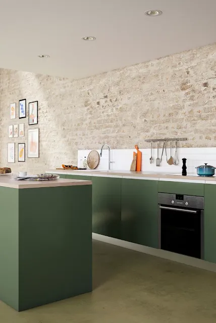 A modern kitchen with exposed stonework