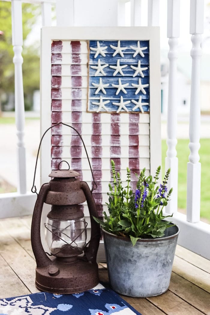 patriotic flag shutter with starfish stars on front porch by The Cottage on Bunker Hill blog
