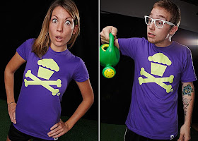 Johnny Cupcake - Green Cupcake and Crossbones Logo on a Purple T-Shirt