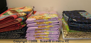 3 stacks of quilts