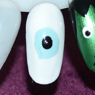 eye ball nail art Halloween blue nail polish barry m blue moon 317 and rimmel london 60 seconds 800 black out dotting tool 