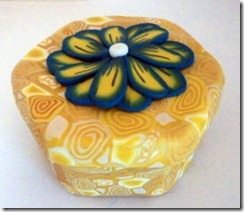 yellow box with blue flower side view