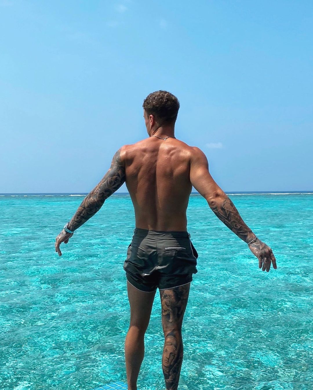 hot-shirtless-man-huge-strong-back-tattoos-kori-sampson-beautiful-ocean-vacation