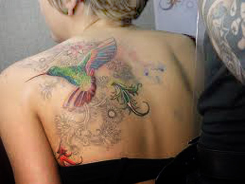 humming bird tattoo. beautiful hummingbird tattoo