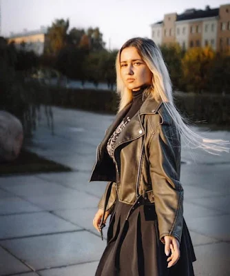 A Blonde Girl Wearing Stylish Brown Leather Jacket