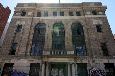 Abandoned neoclassical brick Masonic Temple facade