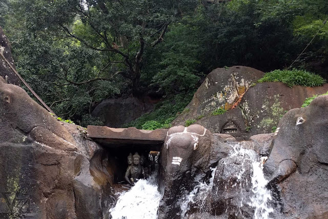 Three elephants carved out of the rocks at the Kalhatti falls