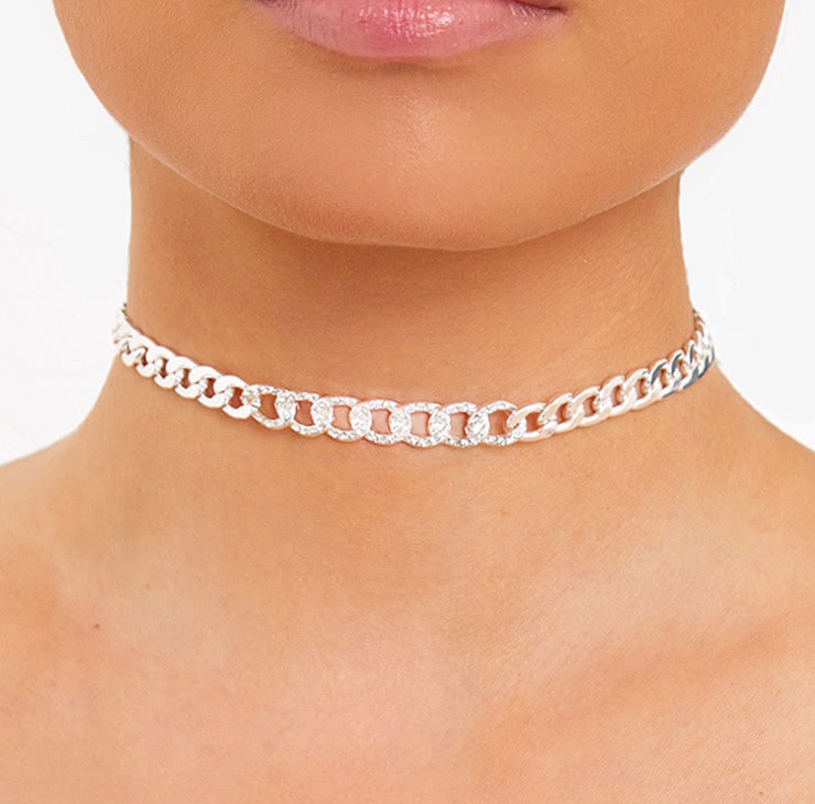 http://www.awin1.com/cread.php?awinaffid=477585&awinmid=7533&p=https://www.prettylittlething.us/silver-diamante-link-chain-choker.html