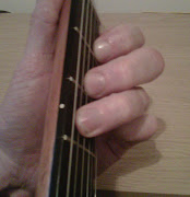 . to make sure that each note of the guitar chord is sounding clearly.