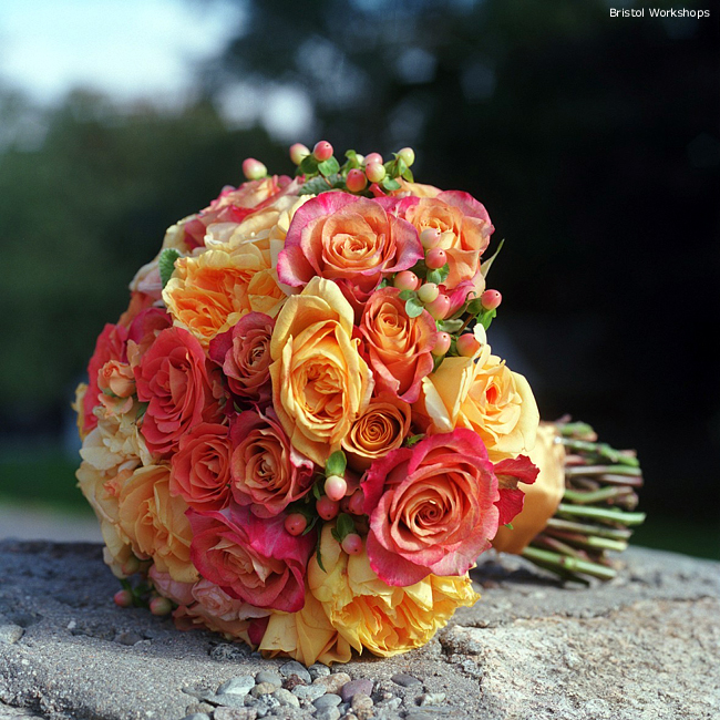 Amazing bridal bouquet made of orange and pink roses