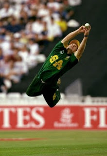 Jhonty Rhodes stretching fully to take a catch 