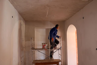 Sally plastering in the dining room