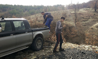 Up the top of the village throwing the dust into the dump