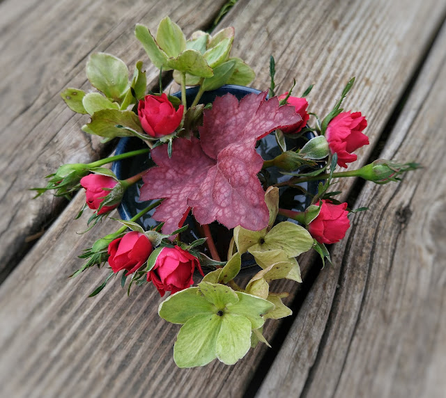 rosebuds, hellebore flowers, and a heuchera leaf for In a Vase on Monday