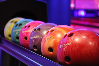 What's the origin of the bowling terms "turkey" and "hambone" for three consecutive strikes?