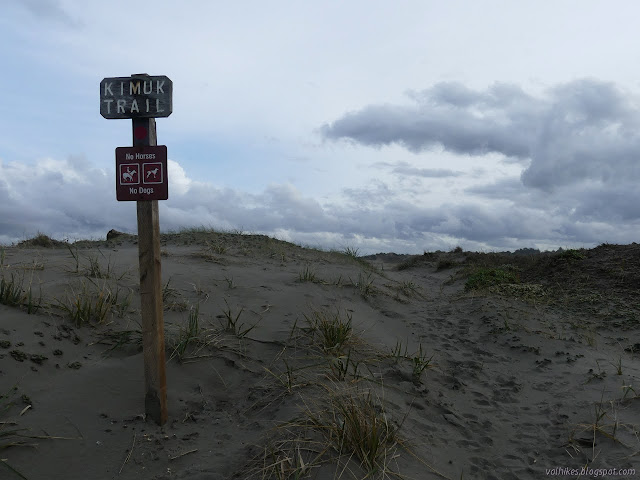 well used trail beside a sign