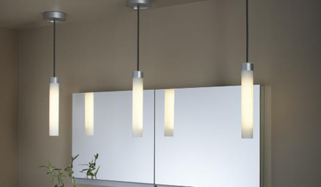 Pendant lights over a bathroom vanity.