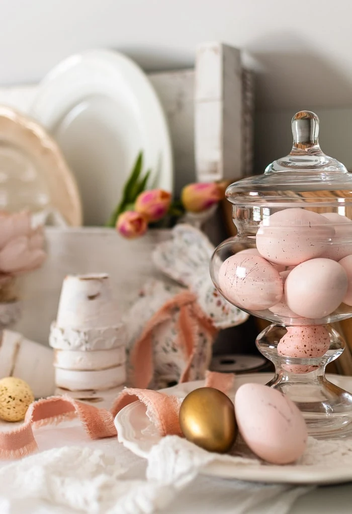 glass jar, pink speckled eggs, velvet ribbon, white ironstone