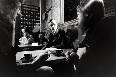 William S. Burroughs with unidentified companions in a Paris cafe, 1959-