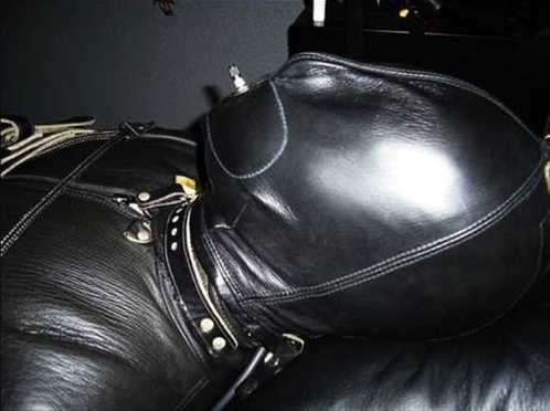 6/12 man bound completely in leather with a hood and straightjacket Face only
