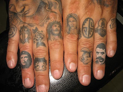 I was on the State of Grace blog and found these finger tattoos done by Ben 