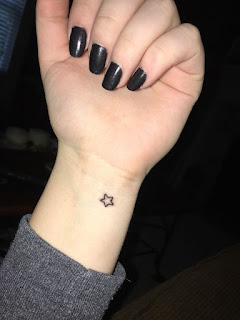 star tattoo on wrist and finger