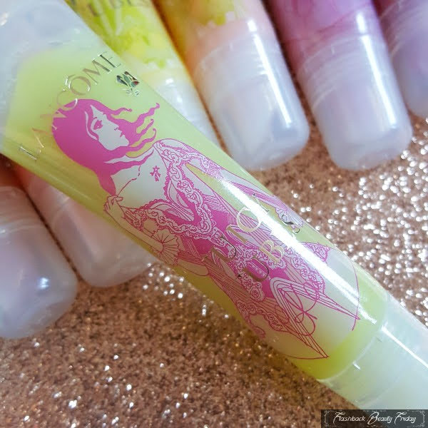 close up of lime coloured lipgloss in clear tube with Christopher Kane fashion illustration on front