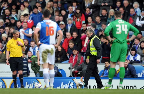 A chicken is released on the pitch during a match between Blackburn and Burnley