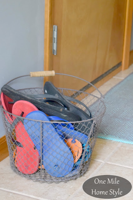 Summer Flip Flop Storage in a Wire Basket - One Mile Home Style