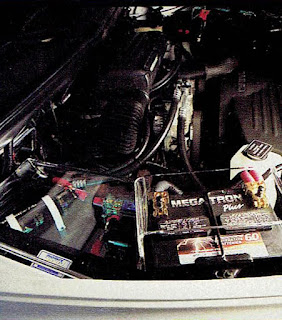 image in color of the engine compartment of Matt Billmeier's 1995 Dodge Ram truck  highlighting the upgraded batteries