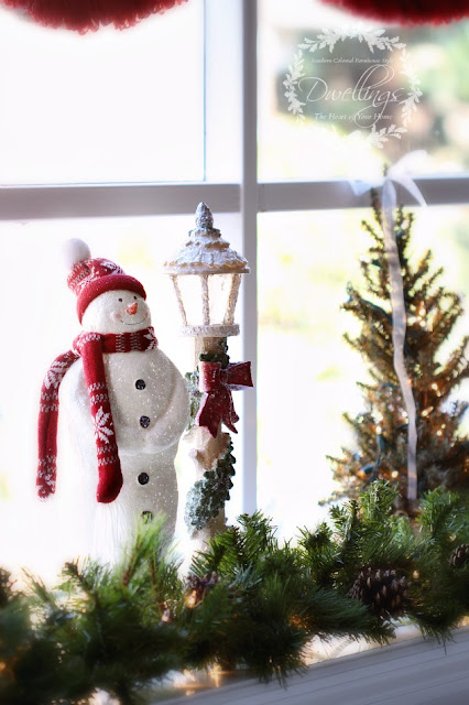 The bay window has been filled with snowmen, Christmas trees and garland.