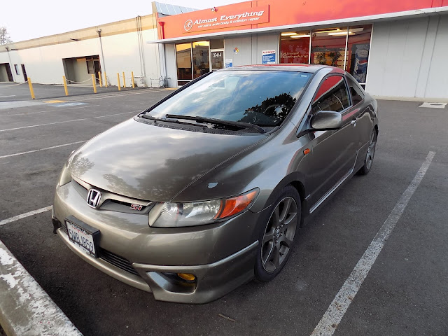 Faded, peeling Honda Civic prior to repairs & paint at Almost Everything Auto Body.