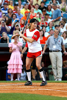 Carrie Underwood at the 19th Annual City of Hope Celebrity Softball Challenge shagging some balls and swinging for the fences