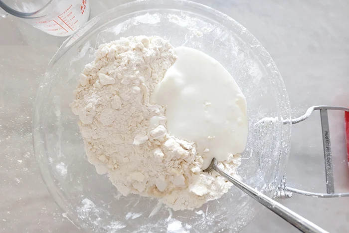 adding buttermilk to dough ingredients