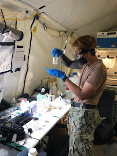 USU CAHS alum Navy Hospital Corpsman 2nd Class Jewel Relador tests for the presence of a chemical contaminant on a sample as part of a water quality analysis during a field exercise at Camp Pendleton, CA. (Photo by HMC Reneline Llamas, USN)