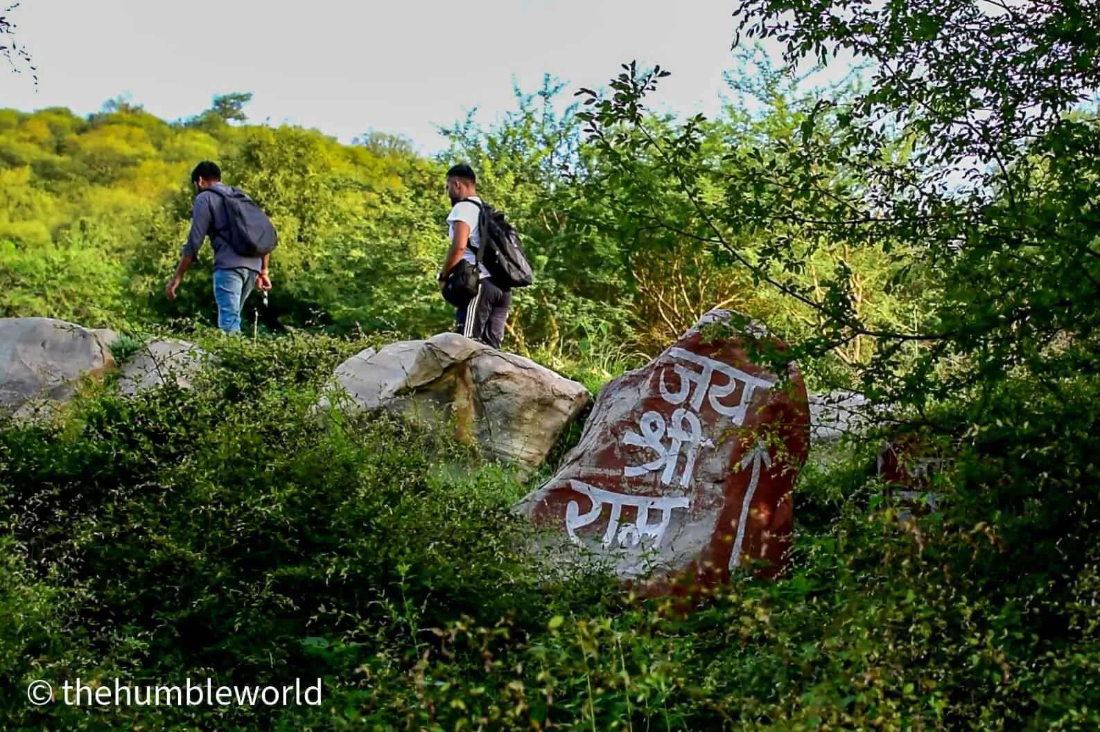 "Jai Shree Ram" written on rocks placed as an indicator on the trek routes