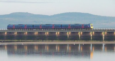 Train crossing Morecambe Bay at Arnside, Cumbria, UK