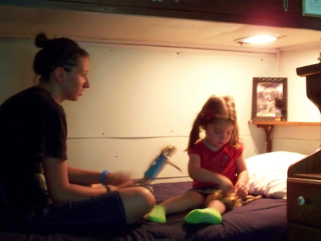 Playing Barbies on the camp bunk