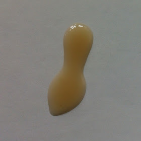 This is a squirt of Jadience Vitality Anti-Aging Serum on a plate.