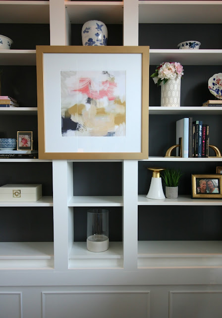 Living Room makeover with custom Ikea Billy bookcase built ins, blush velvet sofa, sherwin williams peppercorn on bookcase, sheriwin williams crushed ice on wall chic living room with picture lights