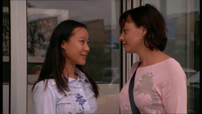 Miranda and Chloe flirt outside their front door of their workplace in the Secret Life of Us