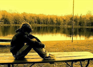 sad boy alone near river-Sad love Shayari 